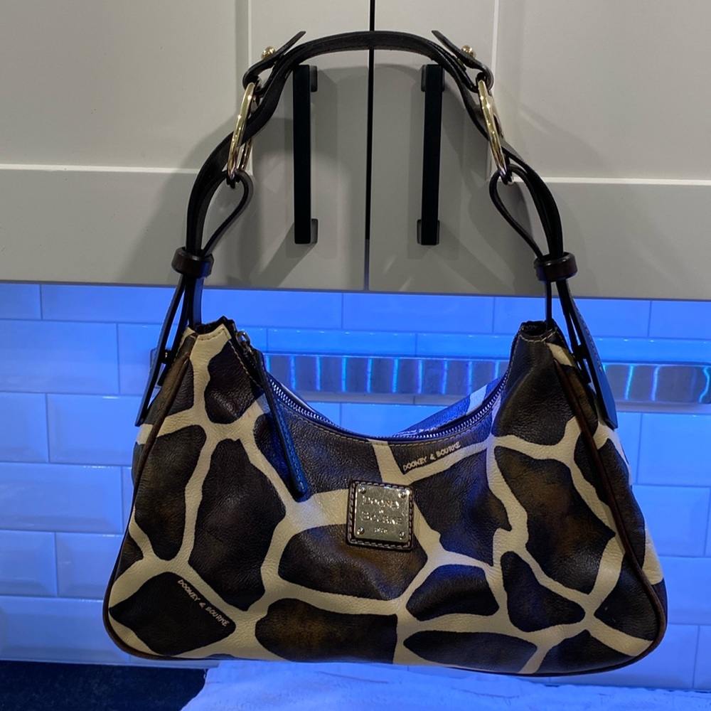 Dooney and Bourke giraffe print purse with matching coin purse.